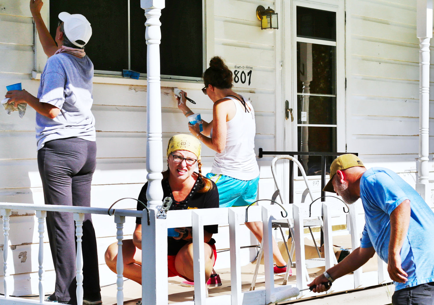 Volunteers busy painting at the Shackleford home.